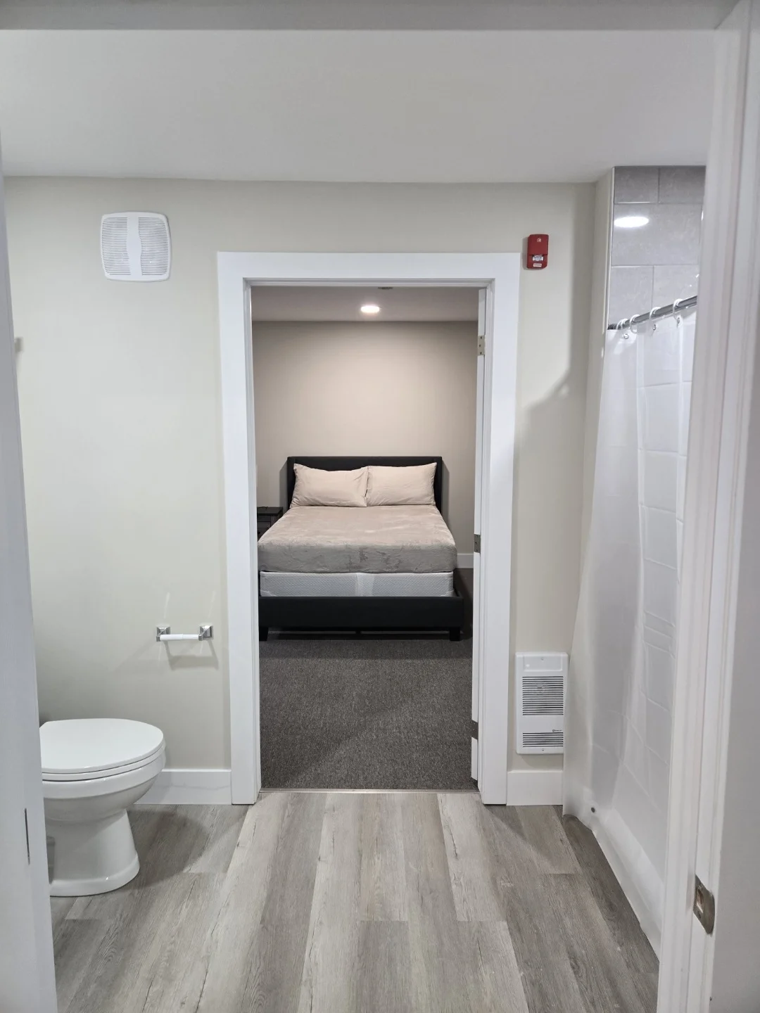 Walk-through bathroom leading to separate bedroom