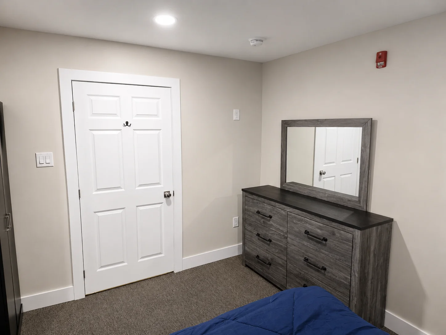 Guest room dresser with mirror and entry door
