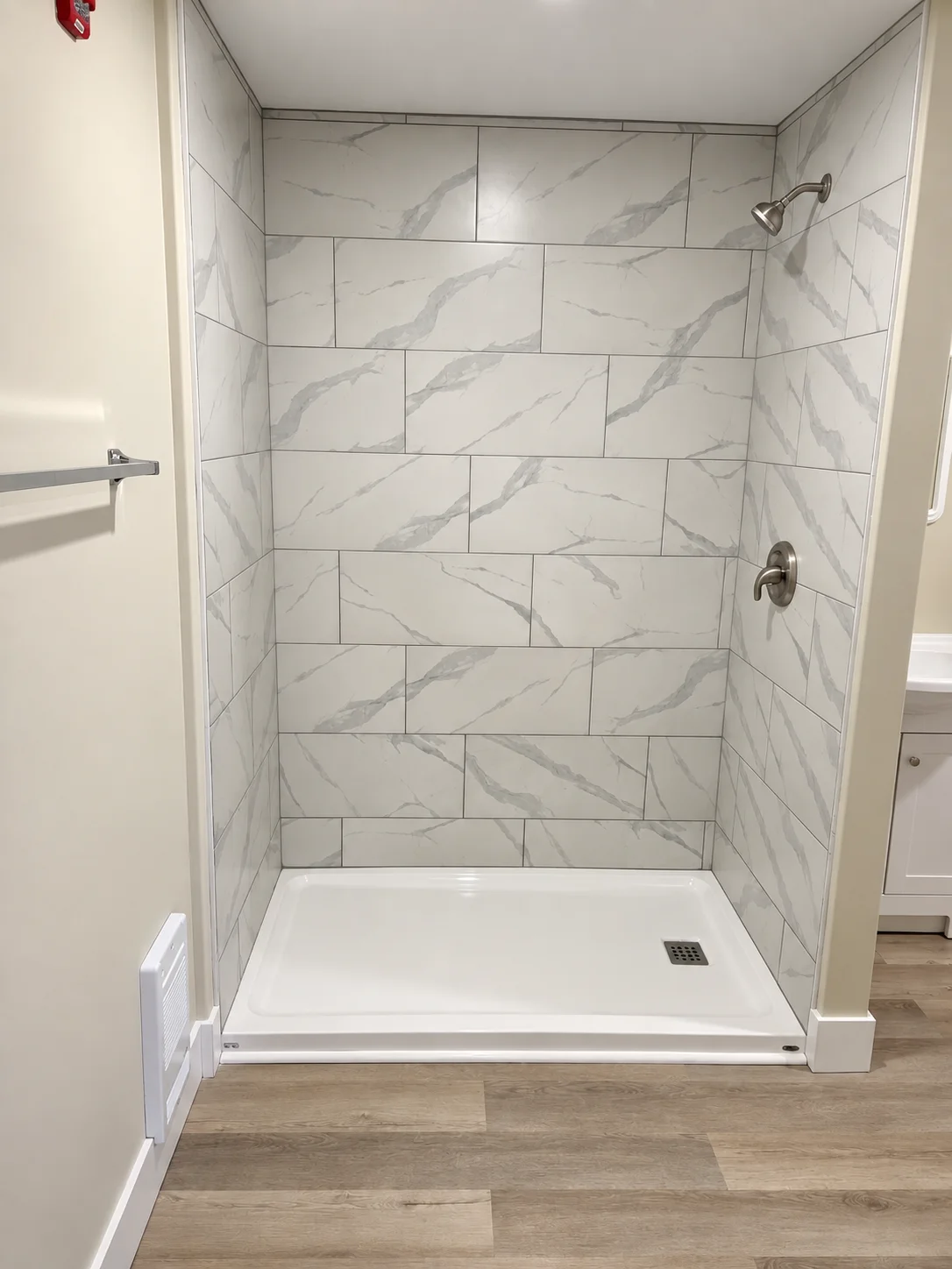 Guest room large marble tile walk-in shower